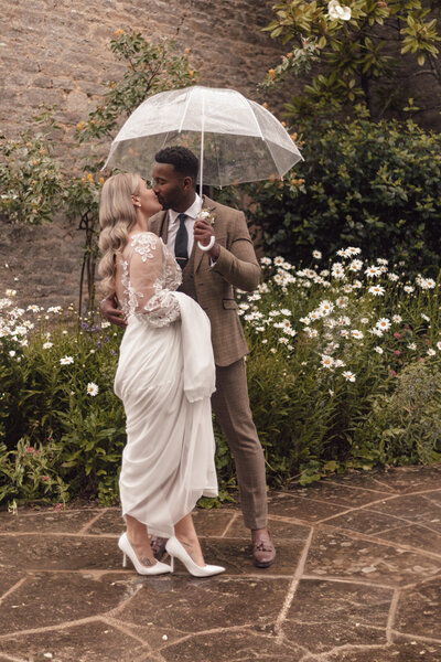 Wedding photographer captures couple taking a stroll hand in hand at their french chateau wedding.