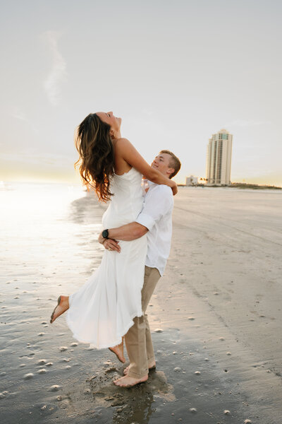 bride on top of the groom's shoulders