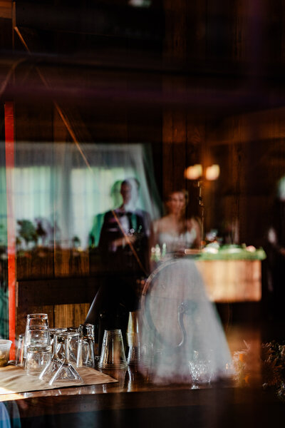 Reflective image of a bride and groom