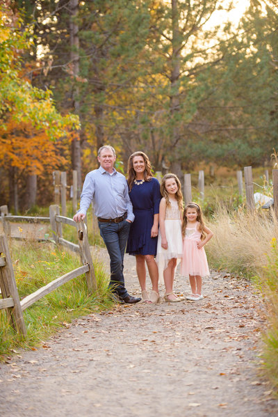 Family of 4 standing together at MK Nature center in Boise,