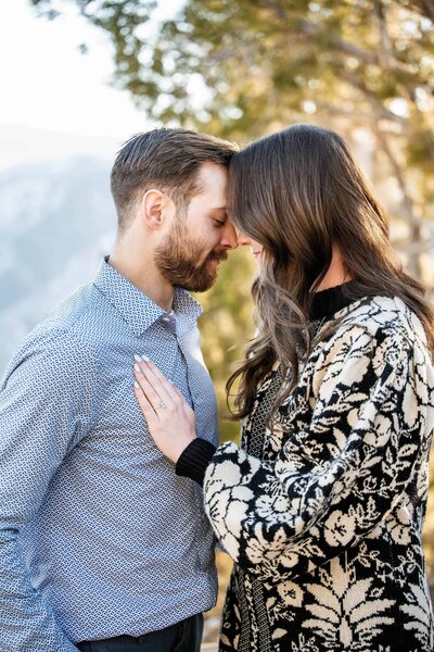 a couple leaning their heads together