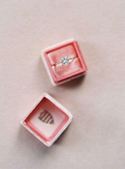 Princess cut engagement ring in a pink velvet ring box