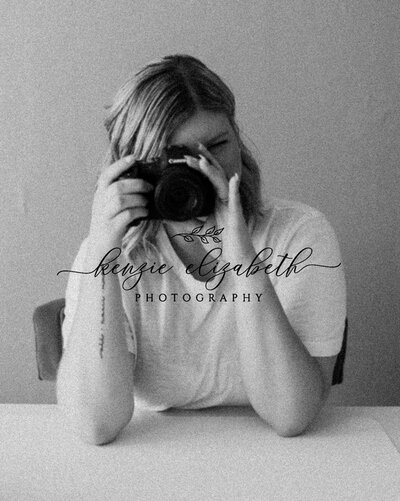 A woman holding a camera is sitting and looking to the left, while a black text logo reads, "Kenzie Elizabeth Photography".