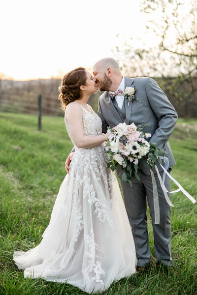bride and groom kissing on their wedding day at Rivercrest Farm