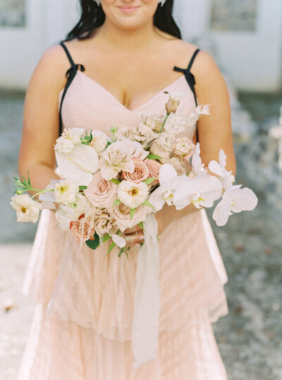 White, tan, blush, cream and champagne flowers, roses, orchids, anthurium, butterfly ranunculus and brownie lisianthus bouquet, marchesa pink dress with black details,