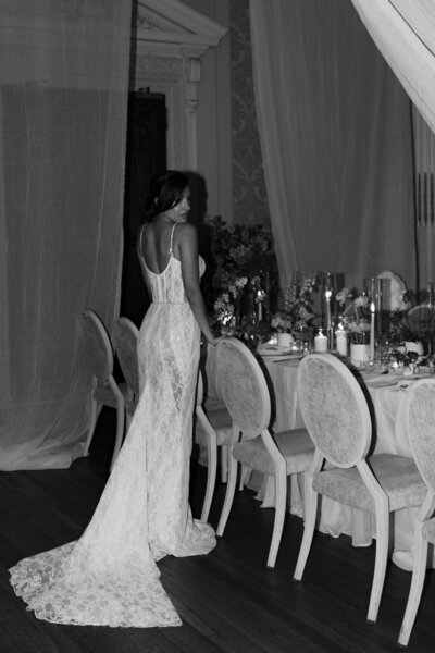Wedding photographer captures couple taking a stroll hand in hand at their french chateau wedding.