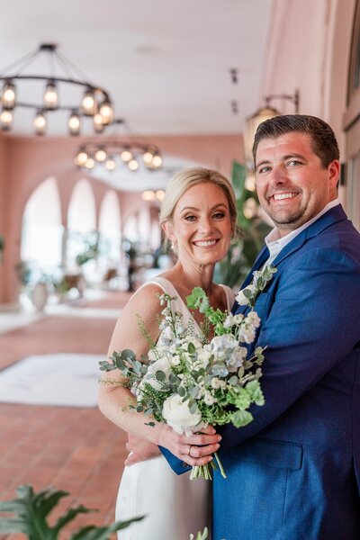 Couple elopes with bright tropical colors on the beach in Treasure Island, FL
