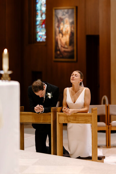 Nikayla & Co. bride cries after receiving the Eucharist for the first time with her husband
