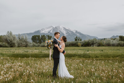 couple embrace in greenhouse