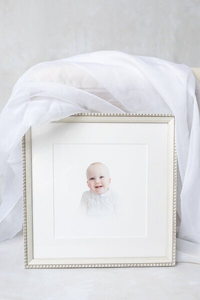 Framed heirloom baby portrait studio display