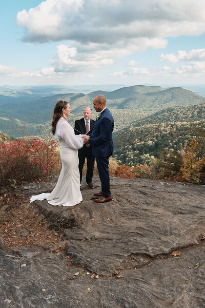 Eloping couple saying their vows overlooking Georgia mountains