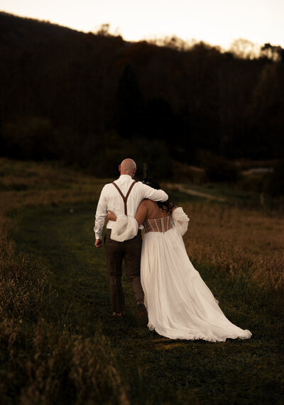 Bride and groom cutting wedding cake