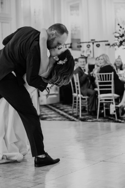 Groom dips bride in first dance