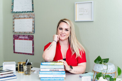 brand photography of a coach posing with her favorite books