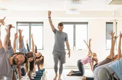 Live Better co-founder Bret Gornik teaching yoga class