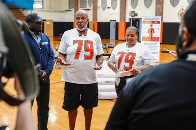 Group of people speaking about The Jordan McNair Foundation