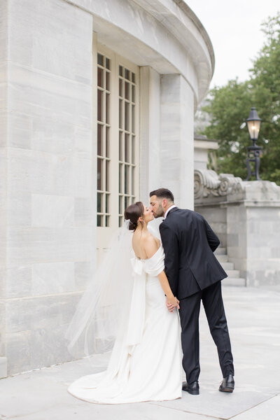 Bride and groom walk up memorial steps at their DC wedding