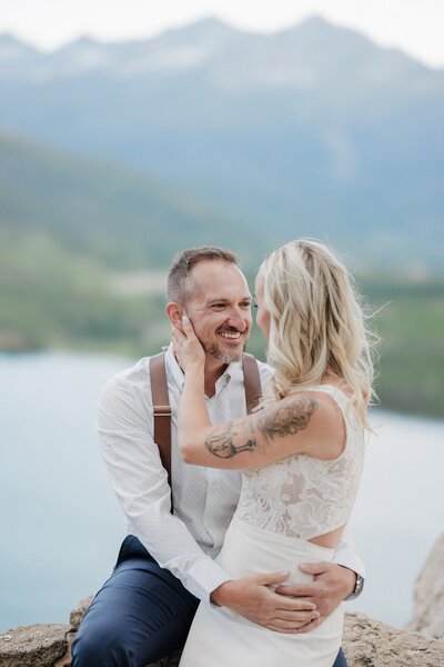 Bride and groom embrace during vow renewal.