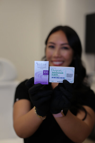 Selena Headshot Holding Botox Dysport Box 1