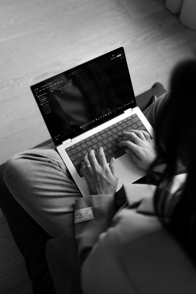 Lead CPA working on a financial plan on her laptop.