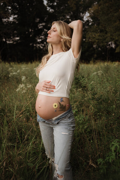 maternity mother in a field with florals