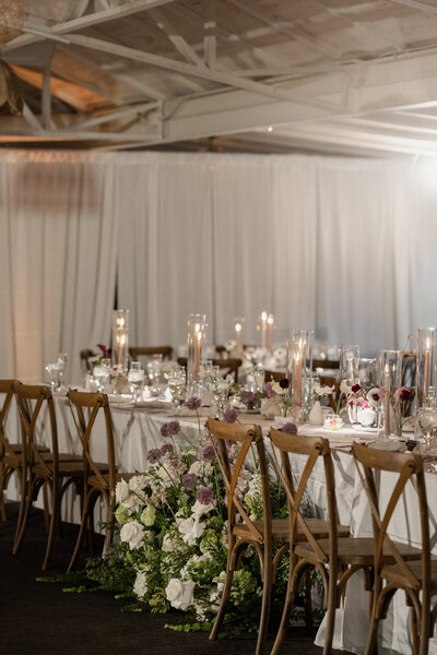 wedding reception table with lush florals and candles in scottsdale, az