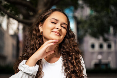  this Christine Image highlights a curly hair girls Beautiful make up and nails. Her senior photo shoot