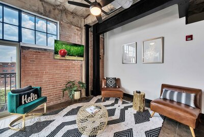 Exposed brick and urban fixture in this one-bedroom, one-bathroom condo in the historic Behrens building in downtown Waco, TX