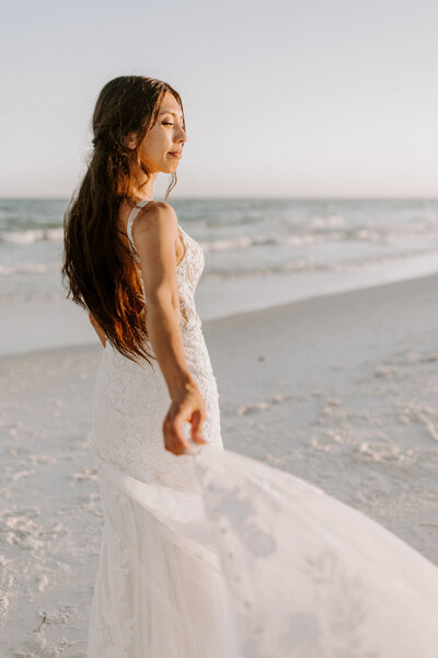 bride walks on beach