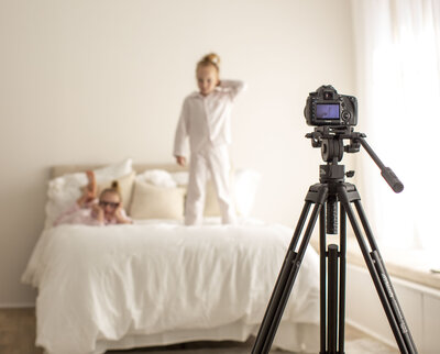 a client review topic image with a camera on a tripod and a session setup in the background, for Bucks  County Photographer Ivory Tree Portraits.