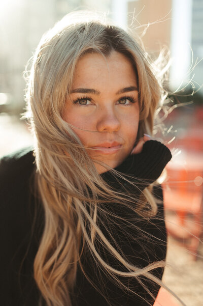 three siblings playing ring around the rosie at blue hour. 