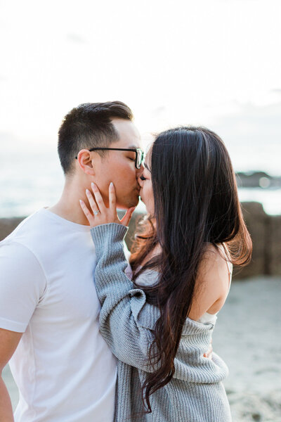 bride and groom kiss passionately