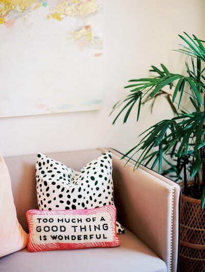 two chairs sitting under plants in a brightly lit office space for CRM expert Caitlyn Gray