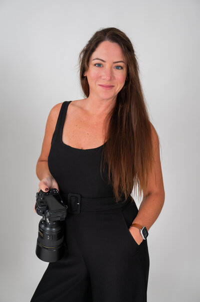 NJ wedding photographer Allison McCafferty standing outside of Liberty State Park in Jersey City NJ