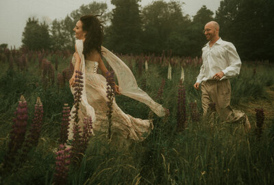 Couple running in field at Acadia National Park, Maine, New England, cinematic moody Super 8 wedding  and elopement photography