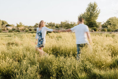 blur image of couple walking in field