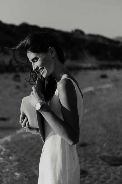 a young woman wearing a white dress