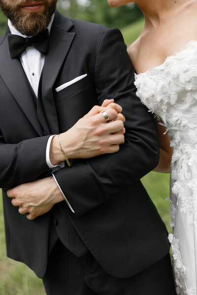 Wedding couple kissing in front of an arched door