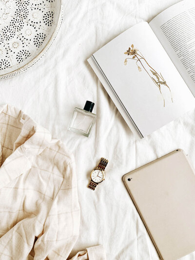 journal with clothing and perfume