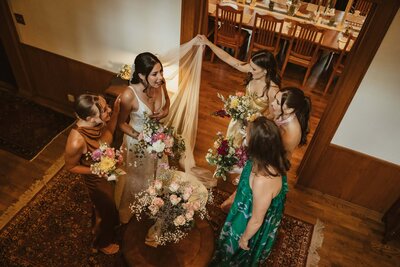 Bridal party shares candid moment getting ready before the ceremony