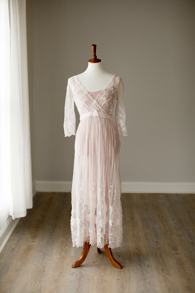 free people baby pink see through lace dress with sleeves over pink slip