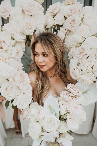 Asian Wedding Artist Jacksonville surrounded by Flowers