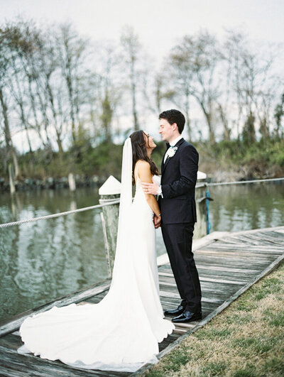 couple sharing a quiet embrace taken on film by film wedding photographers Nicole Simensky