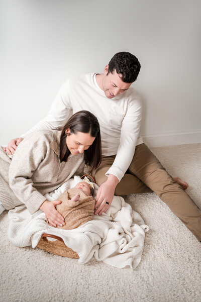 Family photos with newborn sitting on floor