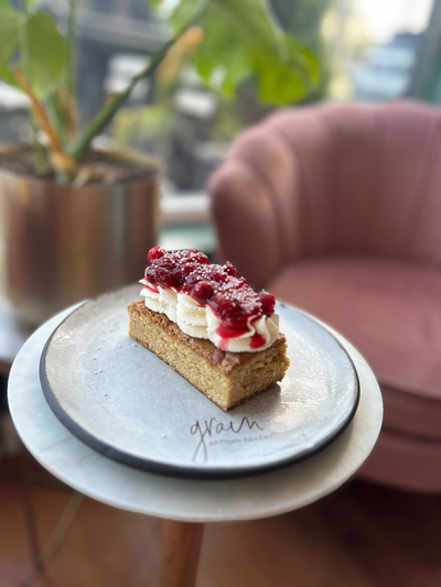 Cranberry Chantilly shortcake topped with whipped cream and fresh cranberries, a gluten-free dessert from Grain Artisan Bakery in Snohomish, WA.