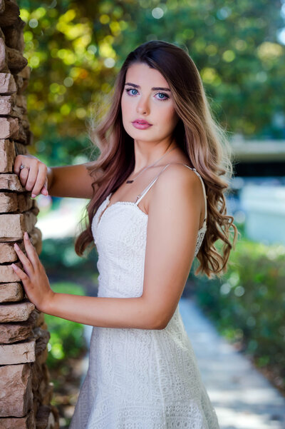 St. Augustne senior portraits with pink flowers