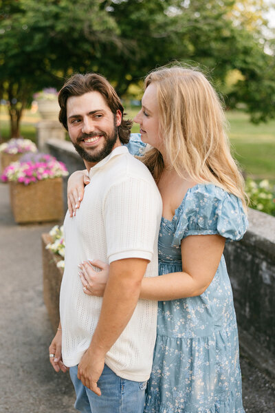 Couple smiling during vibrant Centennial Park engagement session