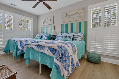 Bedroom two - features two full beds with turquoise decor
