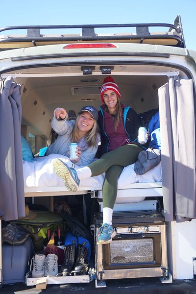 Girls relaxing in camper van in Death Valley