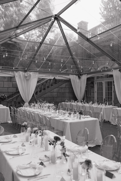 black and white image of a tented wedding reception